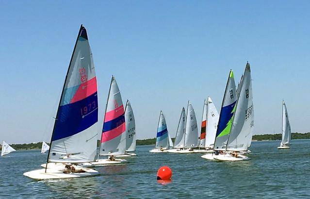 MC Scow fleet rounding a mark at Rush Creek Yacht Club