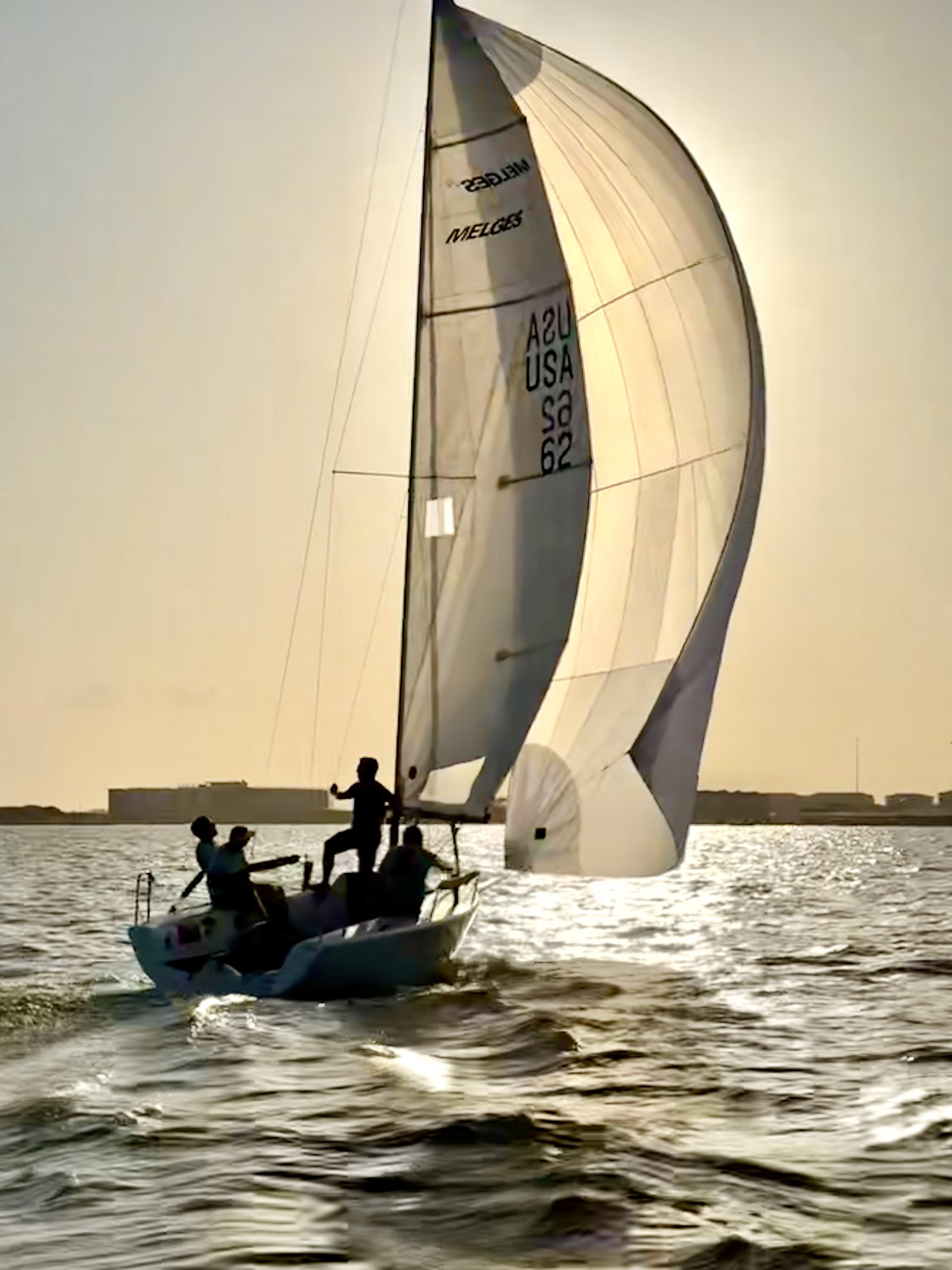 Auxiliary keelboat racing under sail on Lake Ray Hubbard at Rush Creek Yacht Club