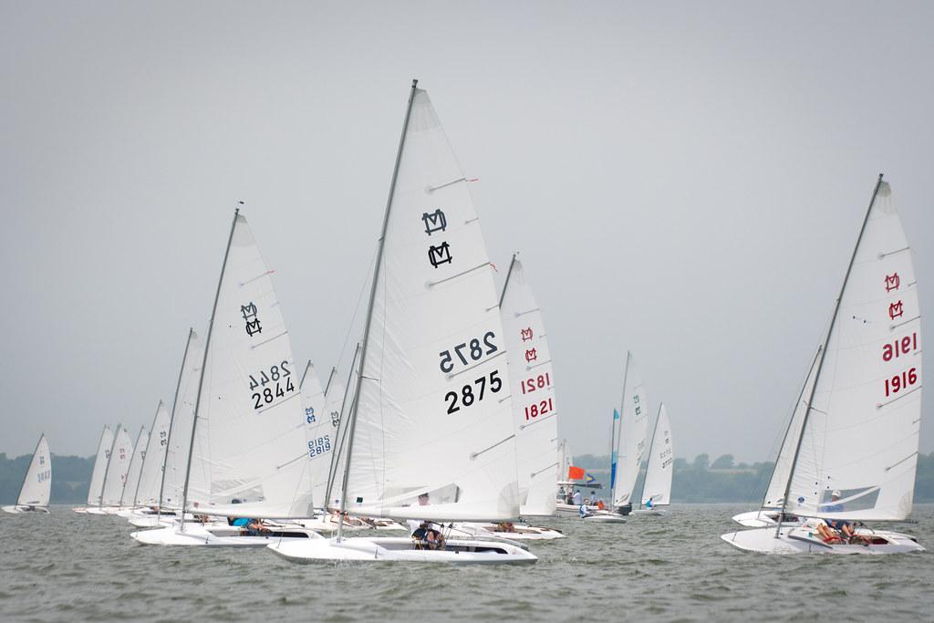 MC Scow fleet racing upwind in a large regatta on Lake Ray Hubbard