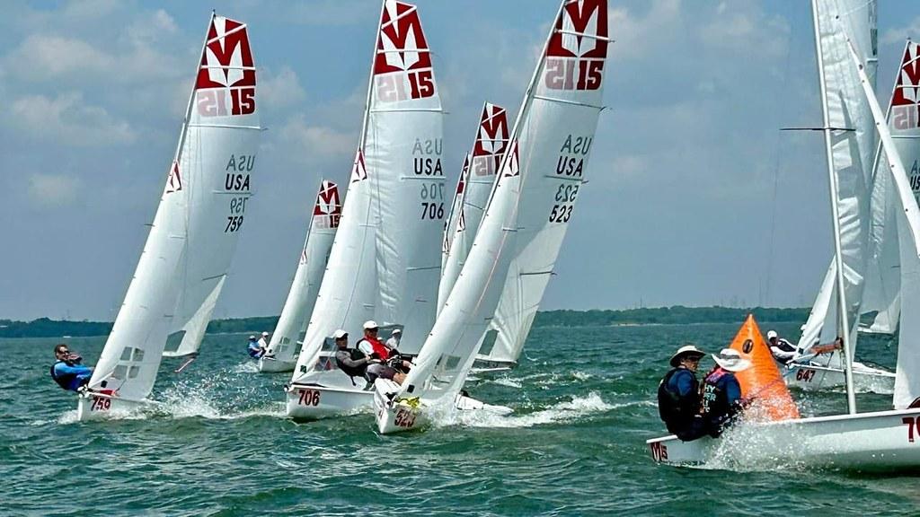 Melges 15 fleet rounding a mark in close racing action on Lake Ray Hubbard