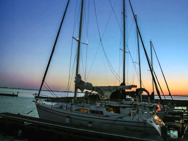 Keelboat moored at Rush Creek Yacht Club at sunset