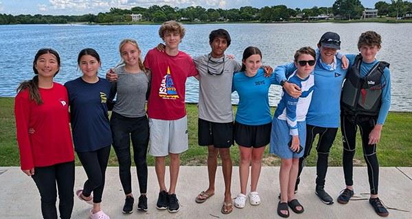 RCYC youth race team squad on the Rush Creek waterfront